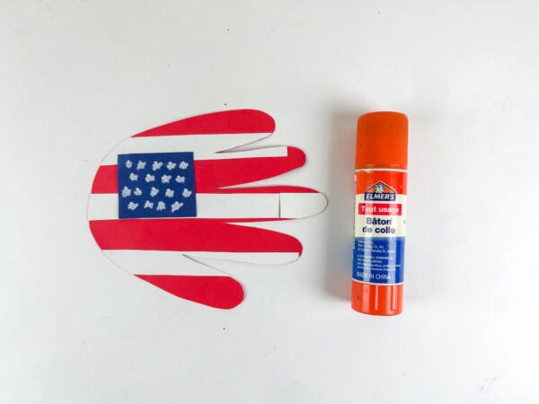Finished handprint flag craft with glue stick

