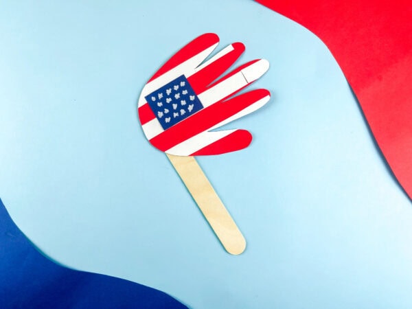 American flag handprint craft on blue background