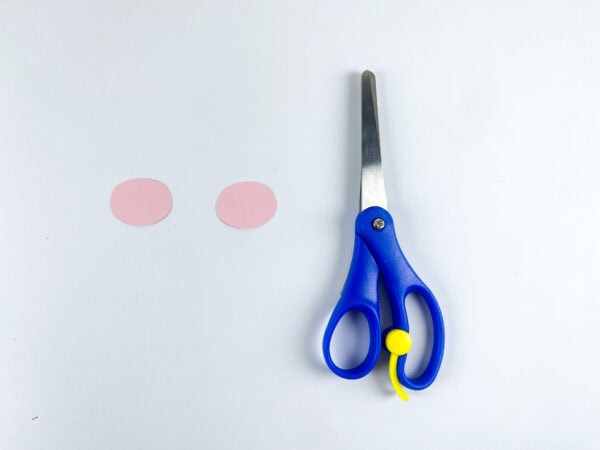 Pink paper circles and scissors