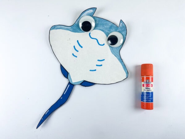 Adding googly eyes to stingray craft