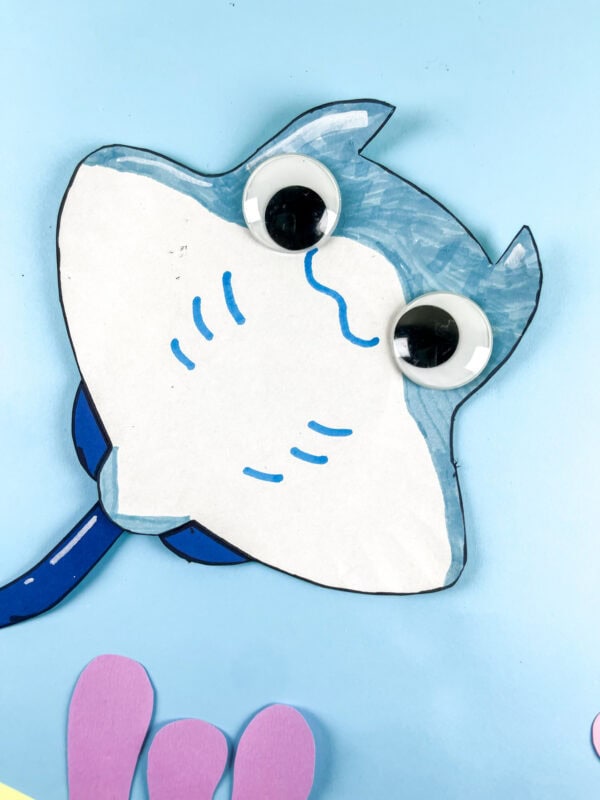 Close-up of stingray paper plate craft on blue background