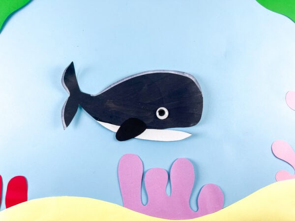 Orca whale craft on ocean background