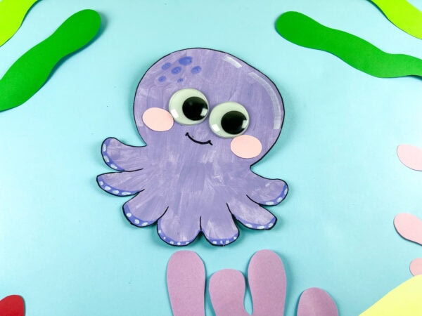 Purple octopus craft on ocean background