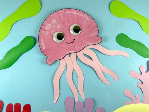 Jellyfish paper plate craft on ocean background