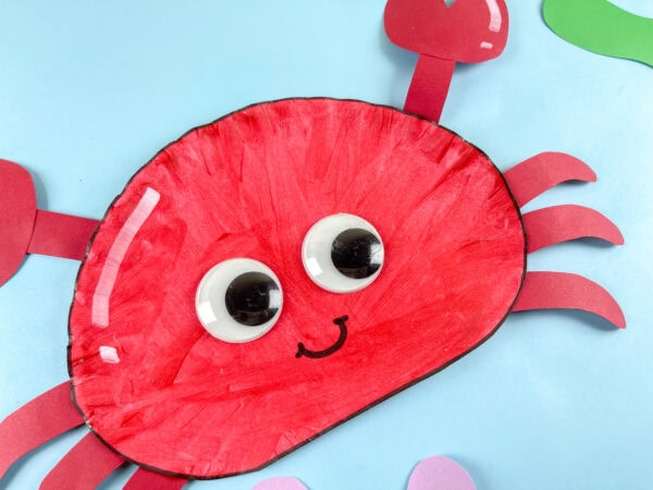Close-up of red paper plate crab face