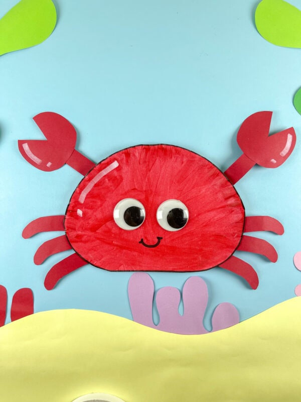 Paper plate crab on underwater scene