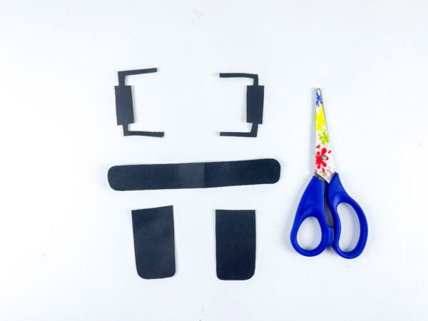 Black paper bus parts and scissors for craft