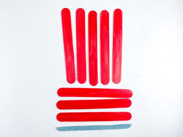 Red popsicle sticks arranged for car base