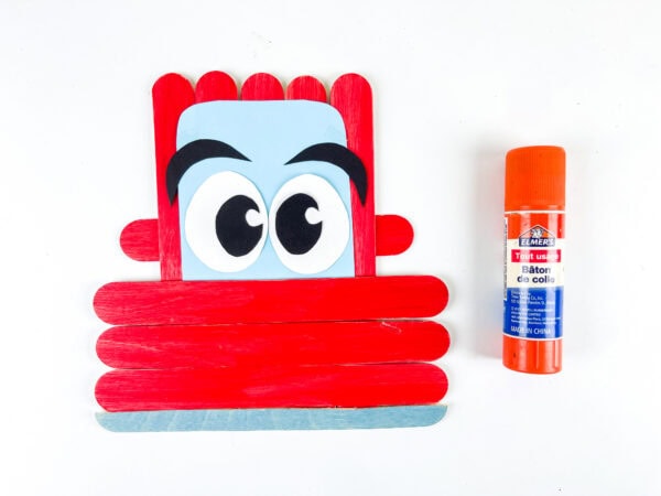 Popsicle stick car with side mirrors and eyes