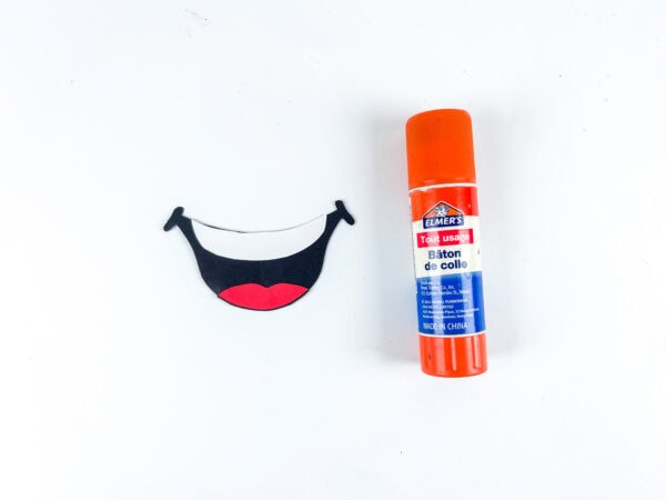 Paper smile cutout for popsicle stick car