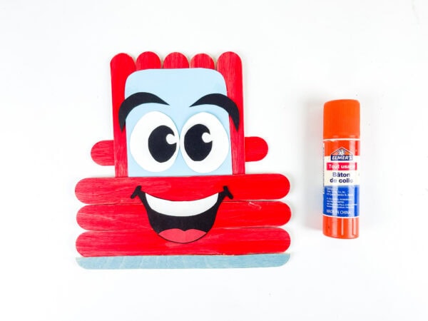 Popsicle stick car with smile attached