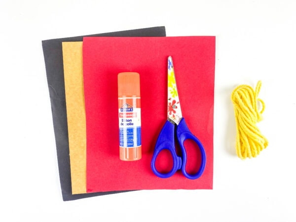 Craft supplies with yellow yarn bundle