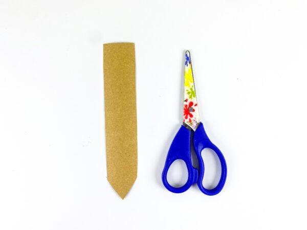 Cut pencil shape beside scissors