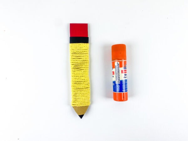 Finished pencil craft with black band and glue stick