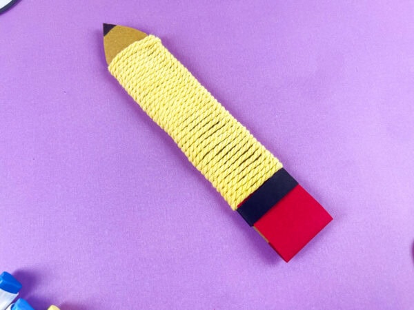 Finished yellow yarn pencil craft close up