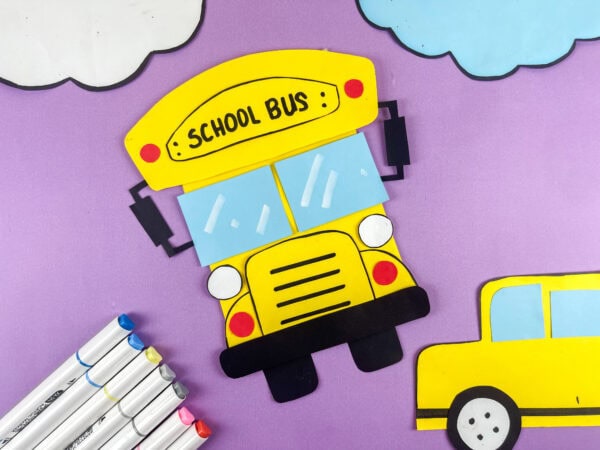 Finished school bus craft on purple background
