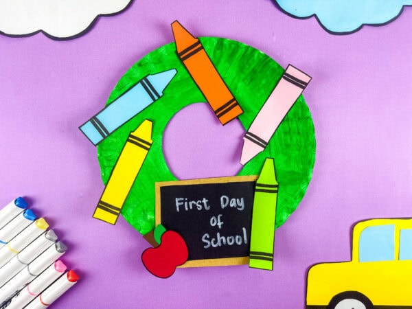 Colorful school wreath craft on purple background