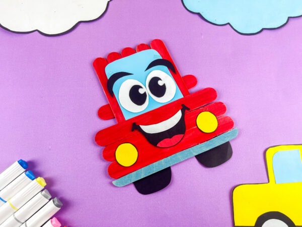 Popsicle stick car craft on purple background