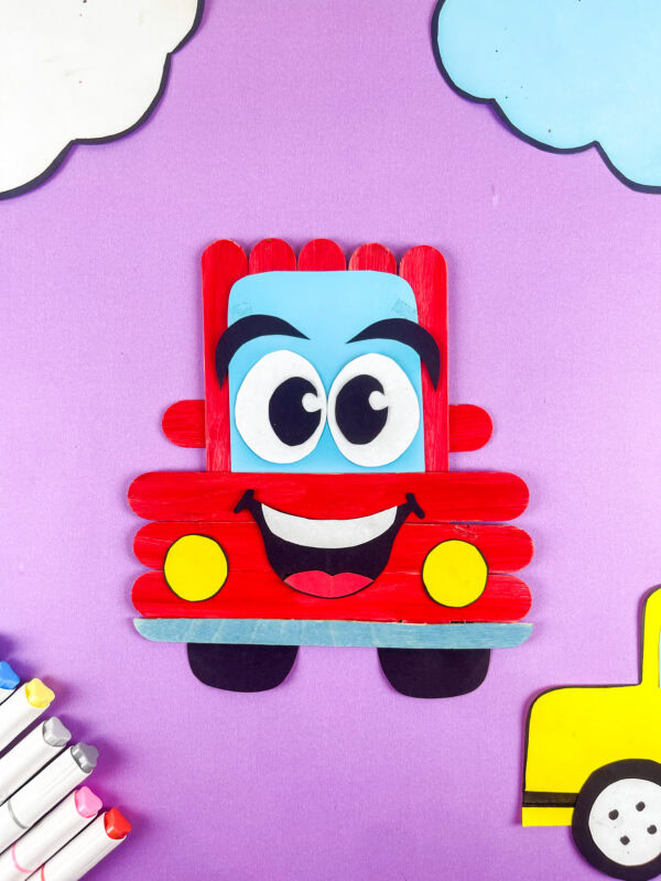 Popsicle stick car craft with clouds background
