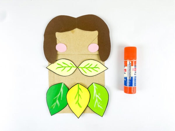 Leaf skirt attached to paper bag