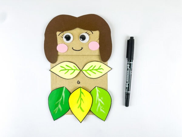 Face drawn on Eve paper bag craft