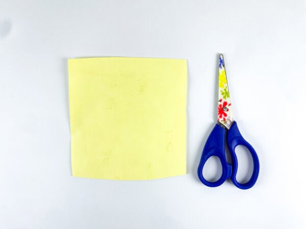 Yellow paper and scissors for craft base