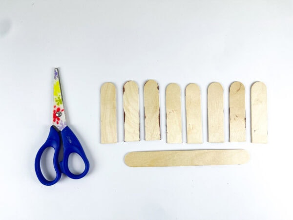 Cut popsicle sticks for basket craft