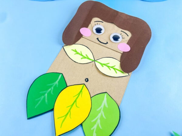 Angled Eve paper bag craft with leaf skirt