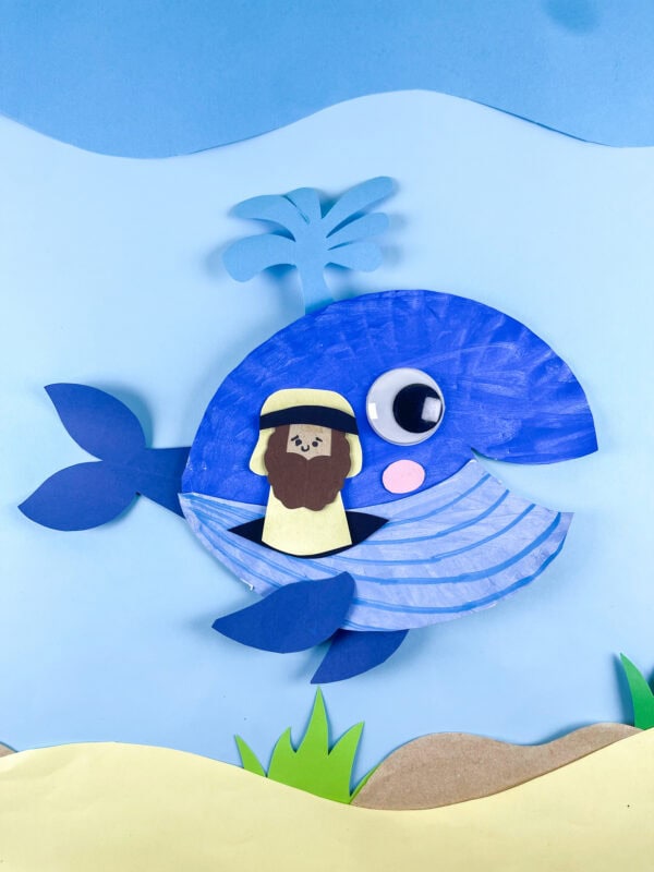 Finished Jonah and the Whale paper plate craft in ocean scene