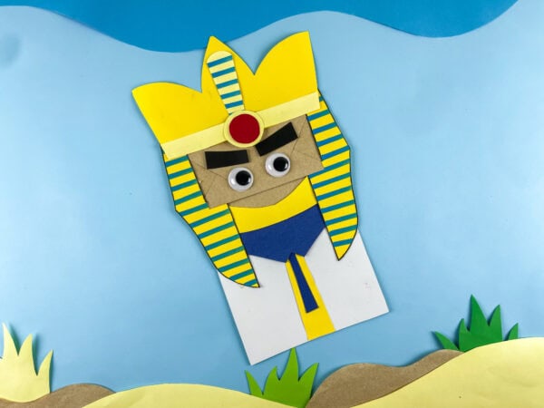 Pharaoh paper bag craft on blue background