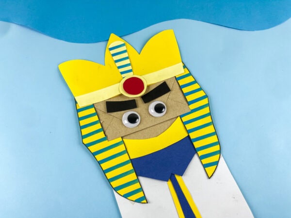 Angled finished Pharaoh Bible craft with blue background.