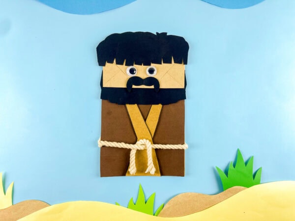 Moses paper bag craft on desert background