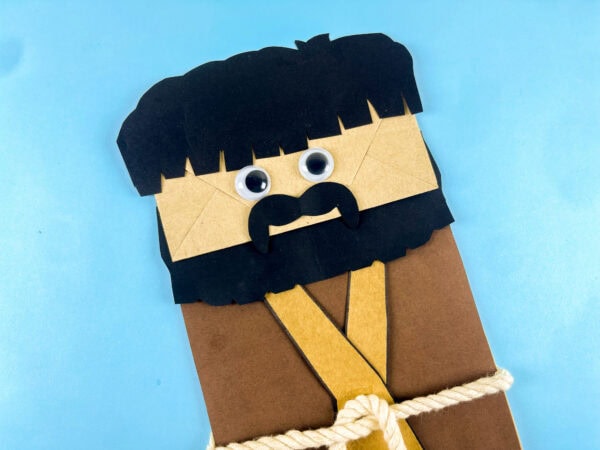Close-up of Moses paper bag character