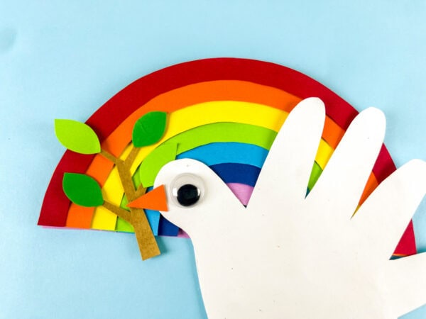 Close-up of dove handprint and rainbow