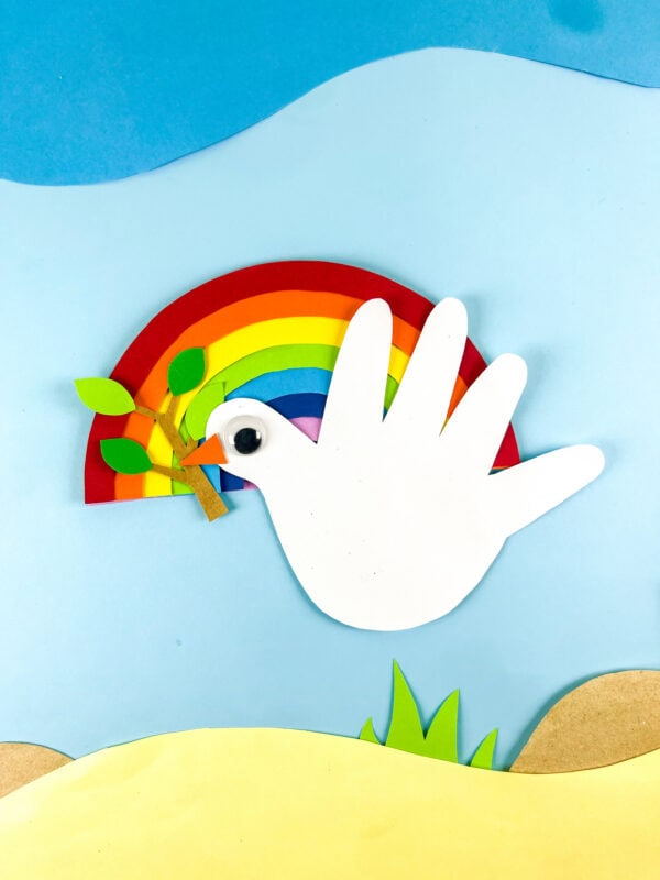 Dove craft with rainbow and landscape scene
