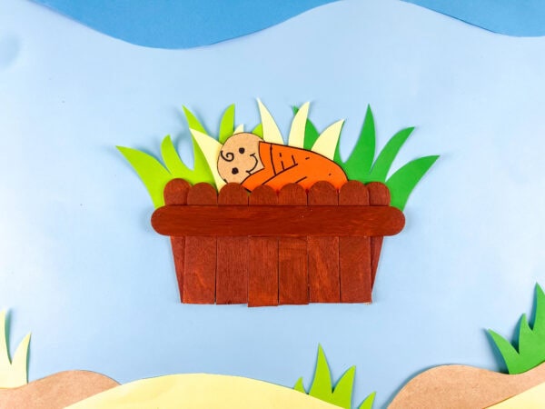 Finished Baby Moses basket craft on blue background