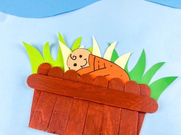 Close up of Baby Moses in basket