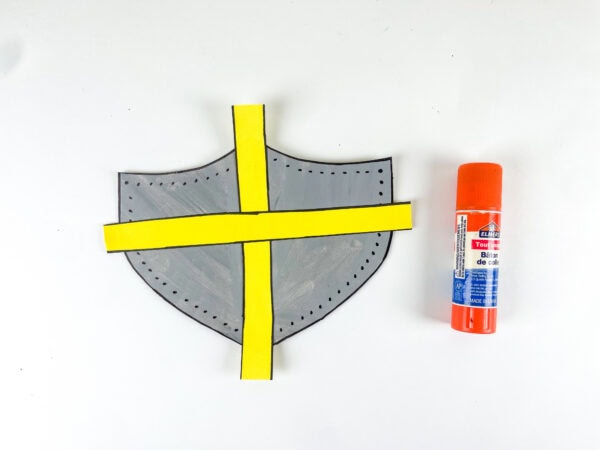 Yellow cross glued onto shield craft