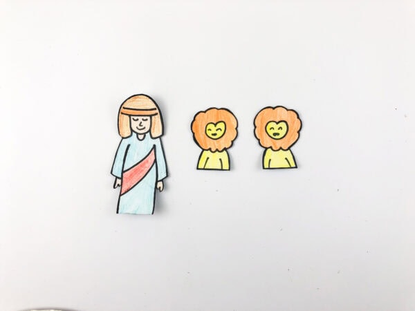Colored cutouts of Daniel and two lions.