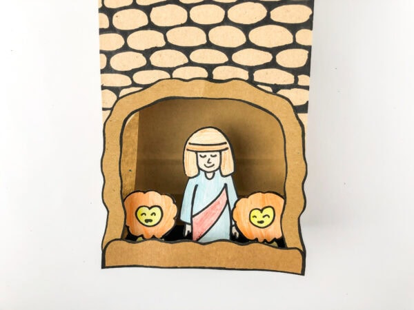 Close-up of the finished craft showing Daniel and lions inside the textured cave.