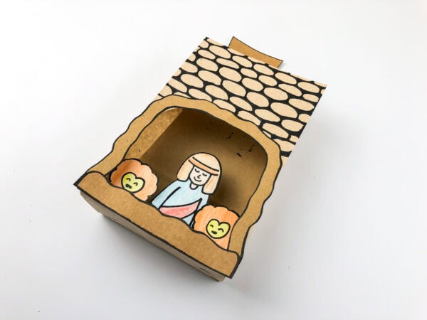Top-down view of the finished paper bag cave craft.