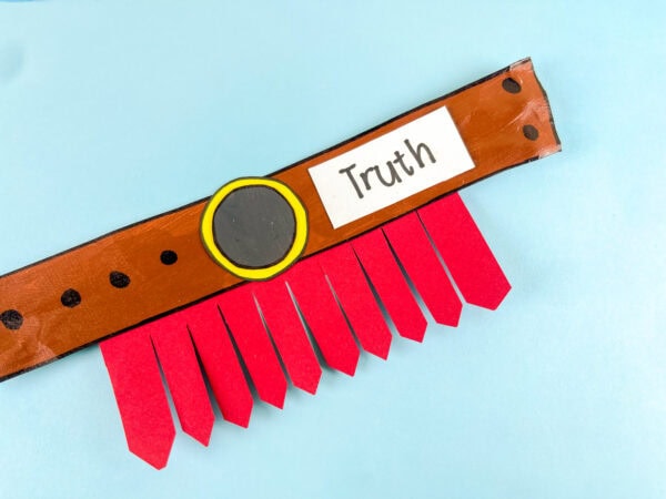 Close-up of truth label and belt buckle