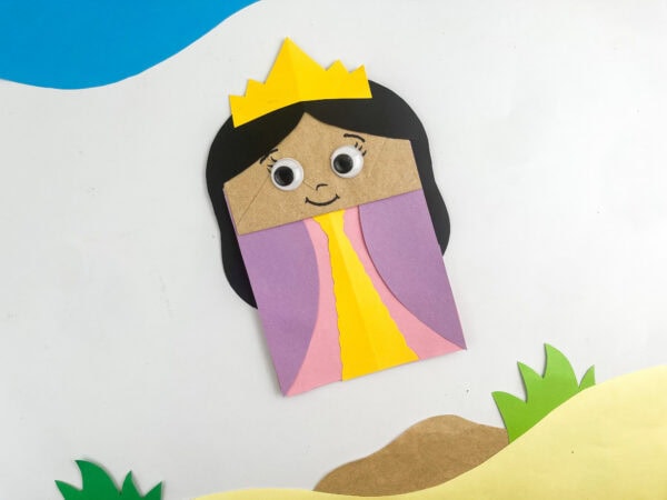 Finished Queen Esther craft propped up against a desert-themed background