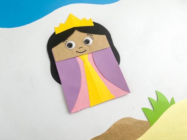 Close-up of finished Queen Esther craft with crown, hair, and smiling face