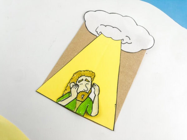 An angled close-up view of the finished Saul conversion paper bag craft on a white background.