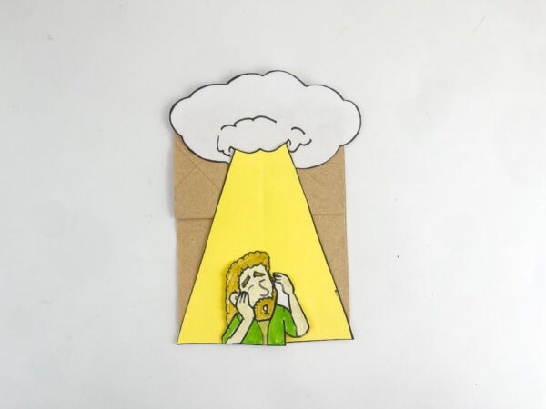 Completed Saul conversion paper bag craft isolated on a plain white background.