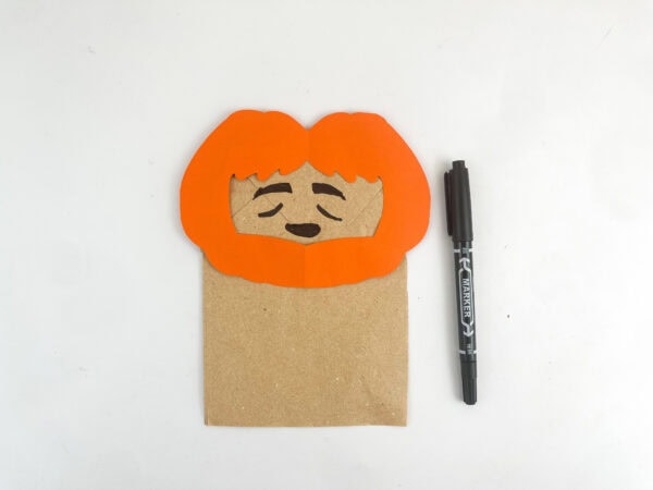 Draw Peter's face on the paper bag