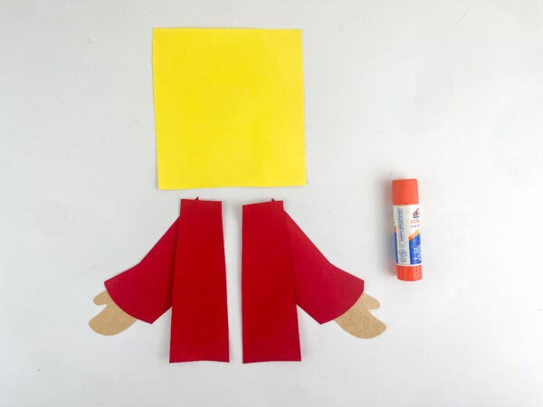 Glue robe pieces onto yellow tunic