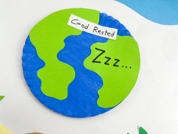 An angled, close-up shot of the finished paper plate Earth craft against a simple background.