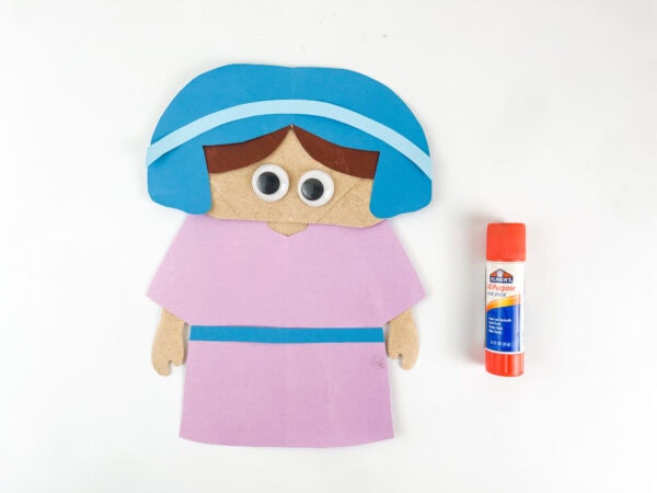 Add googly eyes to Ruth craft